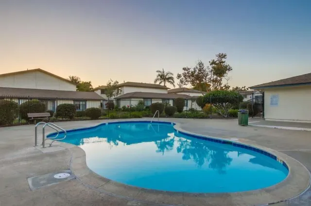 a view of a house with swimming pool