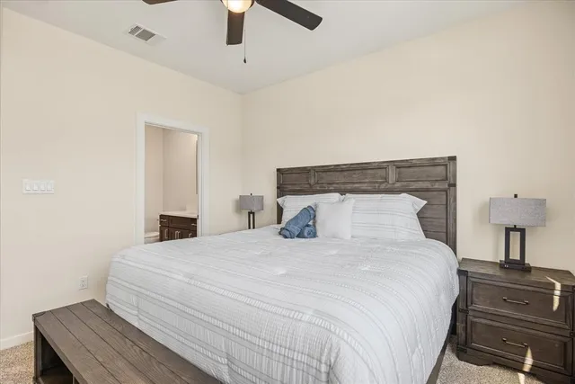 a bedroom with a bed and a cabinets