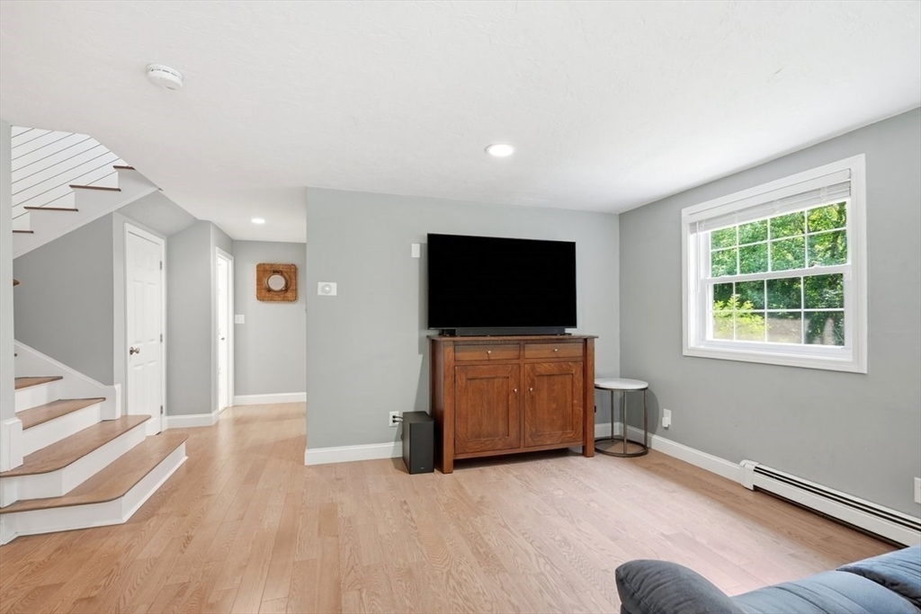47 Old Coach Road Cohasset, MA 02025 - Photo 33 of 40 a livingroom with wooden floor and furniture