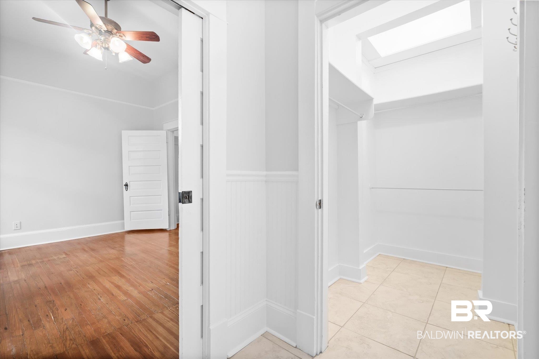14 South Monterey Street Mobile, AL 36604 - Photo 36 of 41 Hallway with light hardwood / wood-style floors and a skylight