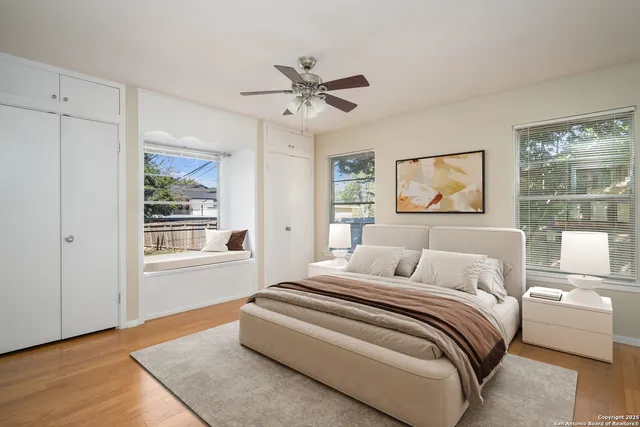 a bedroom with a large bed and a window
