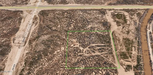 a view of beach and glass door