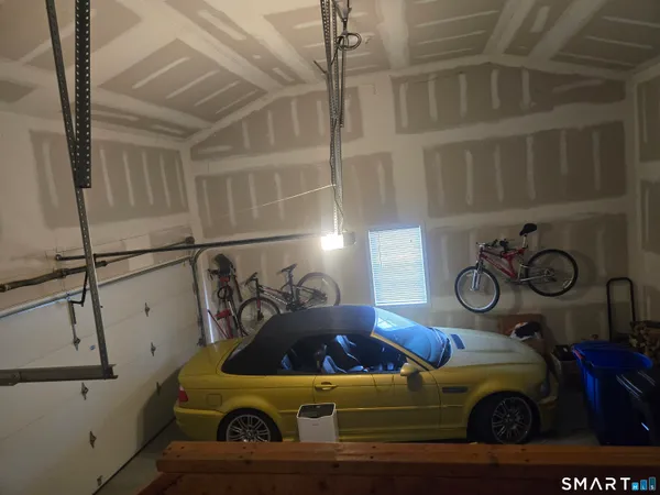 a bedroom with a bed and windows