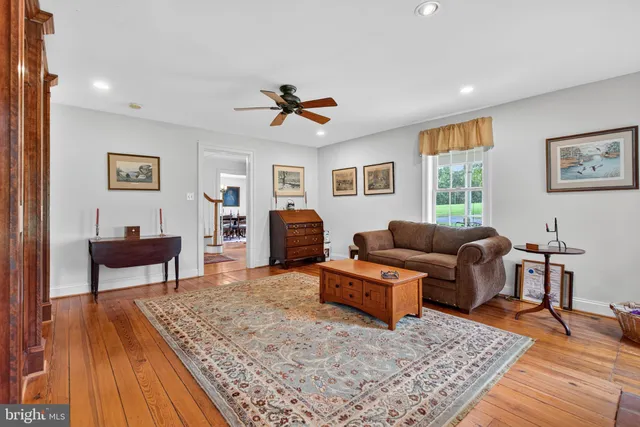 a living room with a couch and a large window