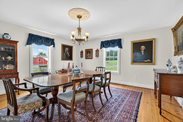 a bathroom with a granite countertop sink toilet a large mirror a shower and vanity