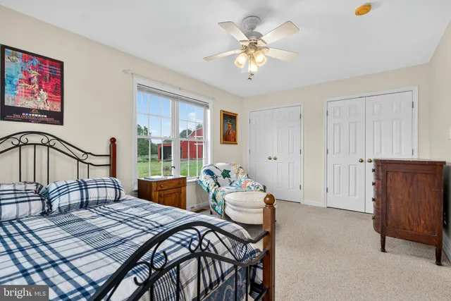 a front view of a house with a garden and deck