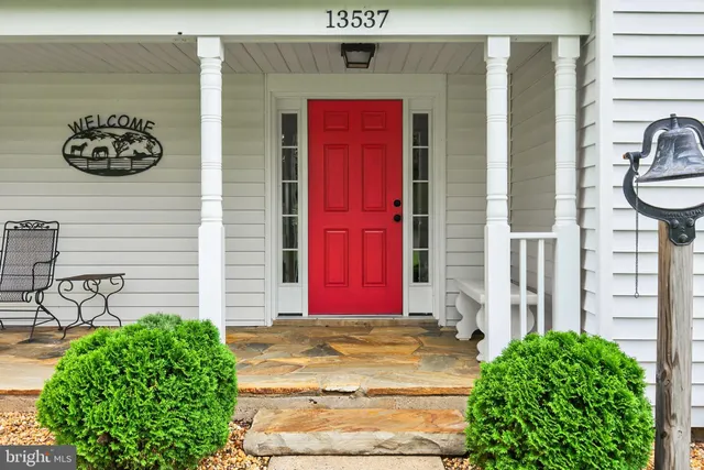 a view of an entryway with wooden floor