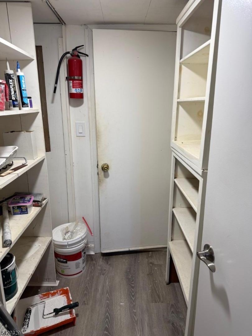 9 MacDonald Road West Milford, NJ 07421 - Photo 11 of 18 a view of a storage & utility room with empty racks