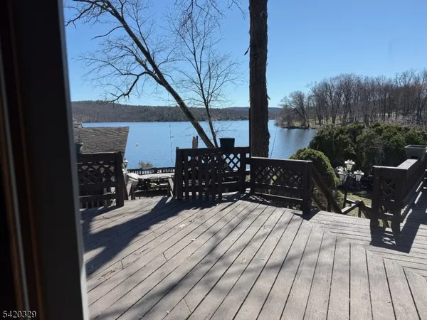 a view of balcony and deck with wooden floor
