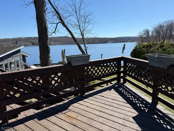 a view of deck with wooden floor and outdoor seating
