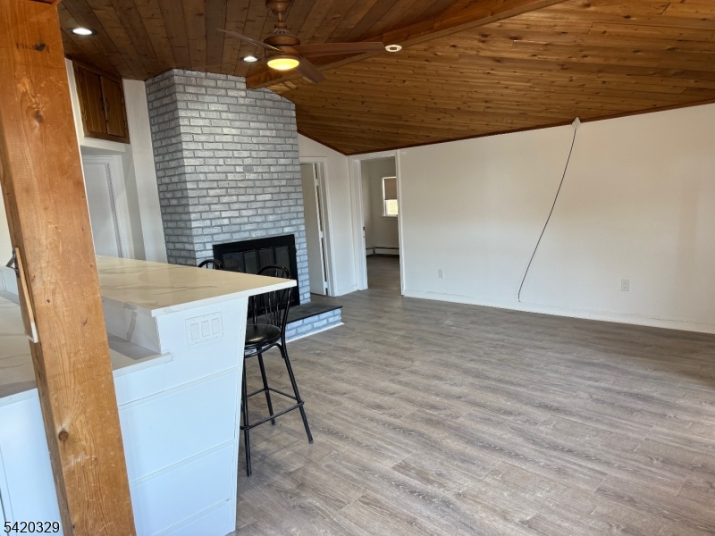 9 MacDonald Road West Milford, NJ 07421 - Photo 4 of 18 a view of a livingroom with fireplace and furniture