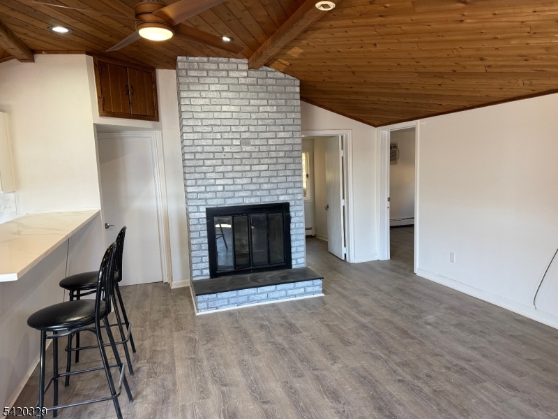 9 MacDonald Road West Milford, NJ 07421 - Photo 5 of 18 a living room with furniture and a fireplace