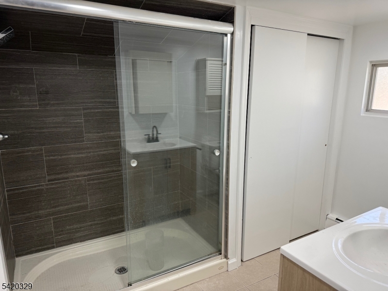 9 MacDonald Road West Milford, NJ 07421 - Photo 7 of 18 a bathroom with a shower and a sink