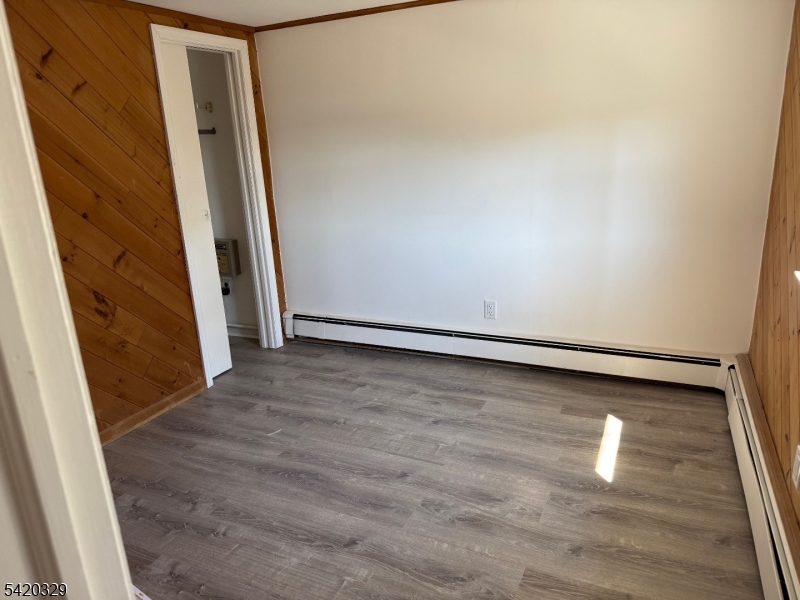 9 MacDonald Road West Milford, NJ 07421 - Photo 9 of 18 an empty room with wooden floor and entrance