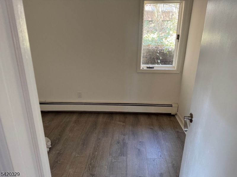 9 MacDonald Road West Milford, NJ 07421 - Photo 10 of 18 a view of a room with wooden floor and a window