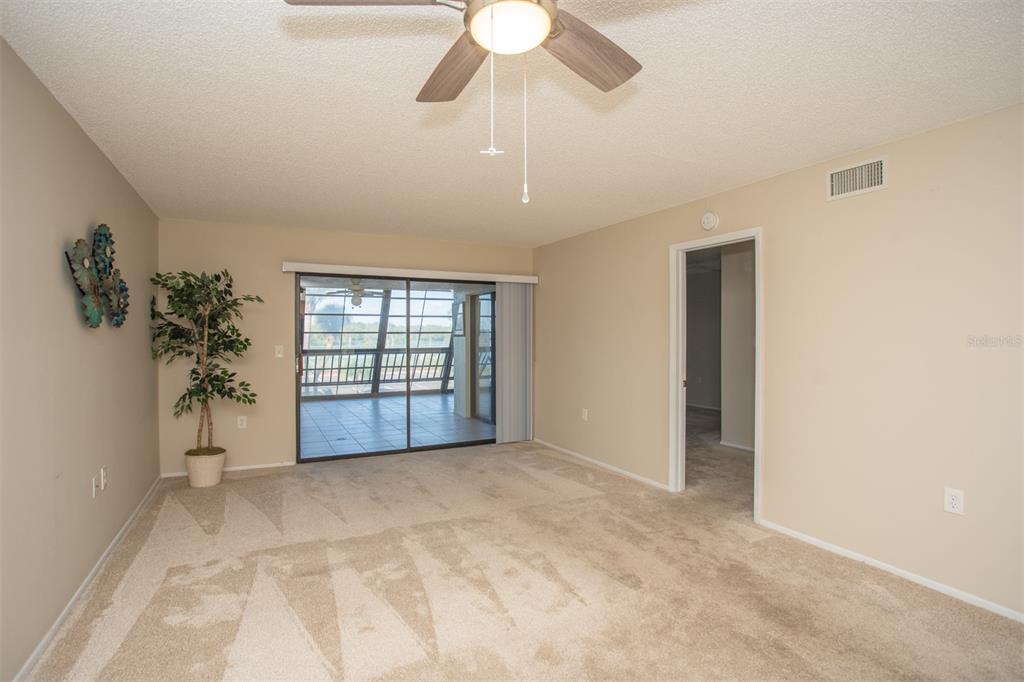 9860 62nd Avenue North, Unit 1014 St. Petersburg, FL 33708 - Photo 14 of 68 a view of an empty room with a window