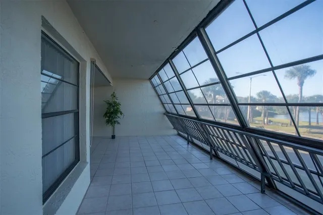 a living room with furniture and a book shelf
