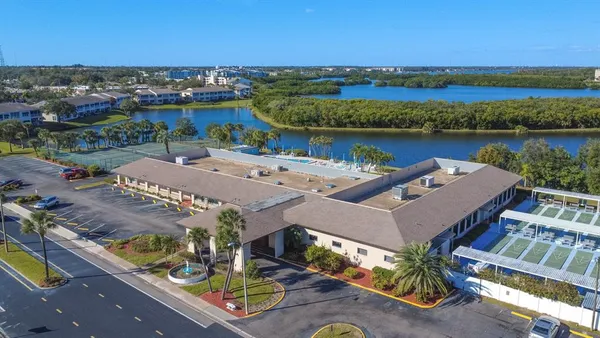 a view of a chairs and table in the balcony