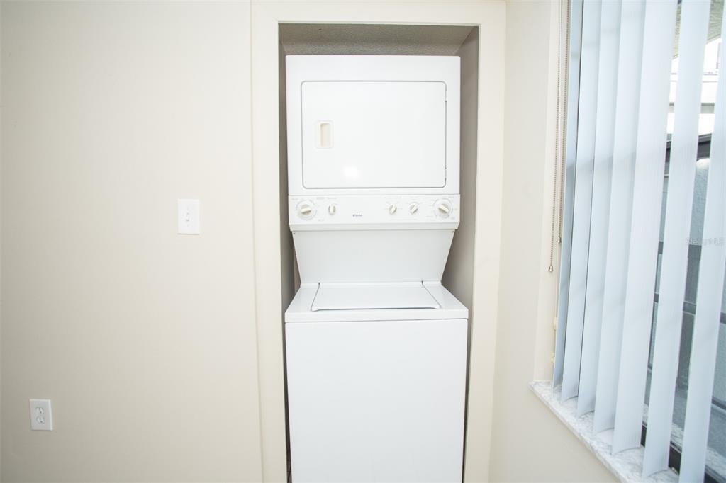 9860 62nd Avenue North, Unit 1014 St. Petersburg, FL 33708 - Photo 41 of 68 a utility room with dryer and washer