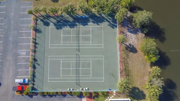 a living room with furniture and a book shelf