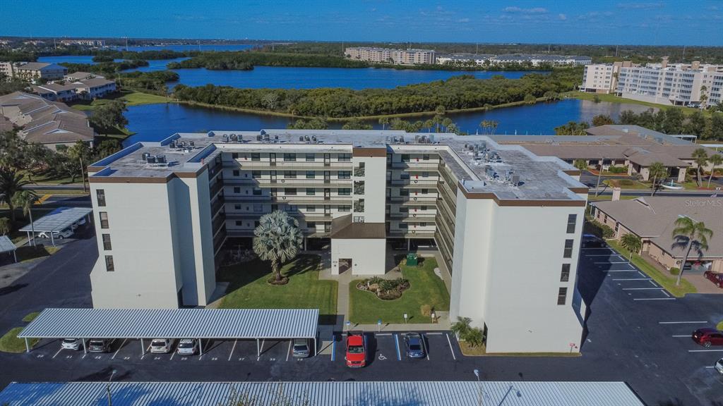 9860 62nd Avenue North, Unit 1014 St. Petersburg, FL 33708 - Photo 49 of 68 an aerial view of a house with a garden