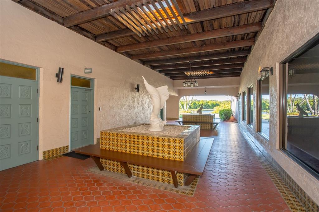 9860 62nd Avenue North, Unit 1014 St. Petersburg, FL 33708 - Photo 52 of 68 a outdoor space with lots of furniture and a rug