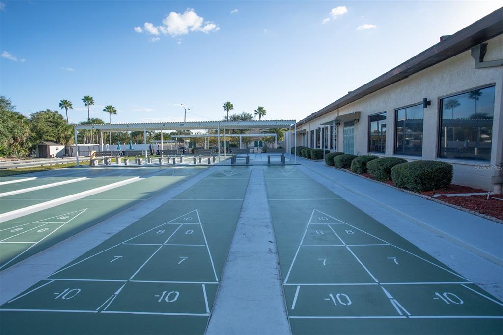 9860 62nd Avenue North, Unit 1014 St. Petersburg, FL 33708 - Photo 59 of 68 a view of a tennis court