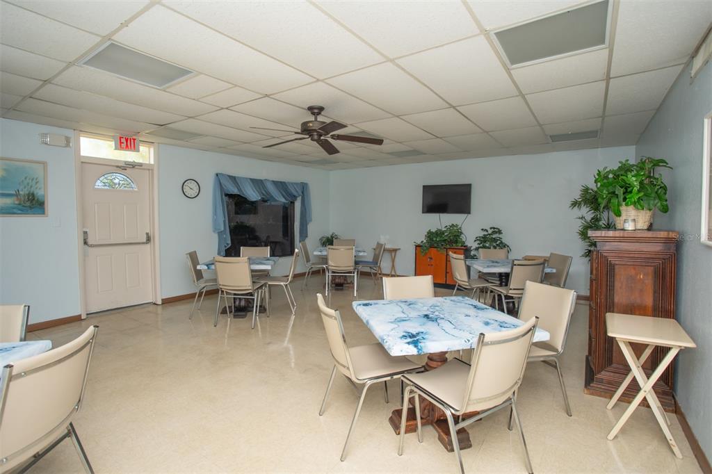 9860 62nd Avenue North, Unit 1014 St. Petersburg, FL 33708 - Photo 62 of 68 a view of a dining room with furniture