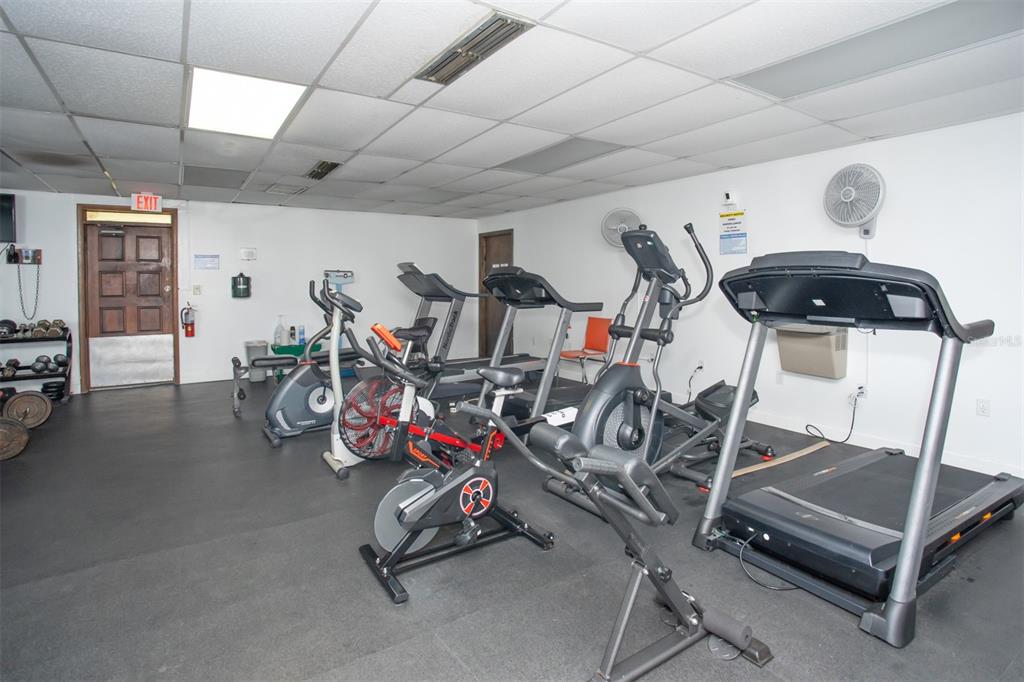 9860 62nd Avenue North, Unit 1014 St. Petersburg, FL 33708 - Photo 63 of 68 a view of a room with gym equipment