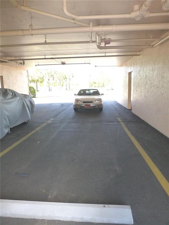 9860 62nd Avenue North, Unit 1014 St. Petersburg, FL 33708 - Photo 9 of 68 a view of a car in garage