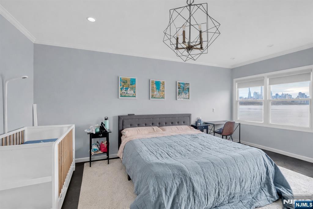 314 The Promenade Edgewater, NJ 07020 - Photo 15 of 37 a bedroom with a bed and a window