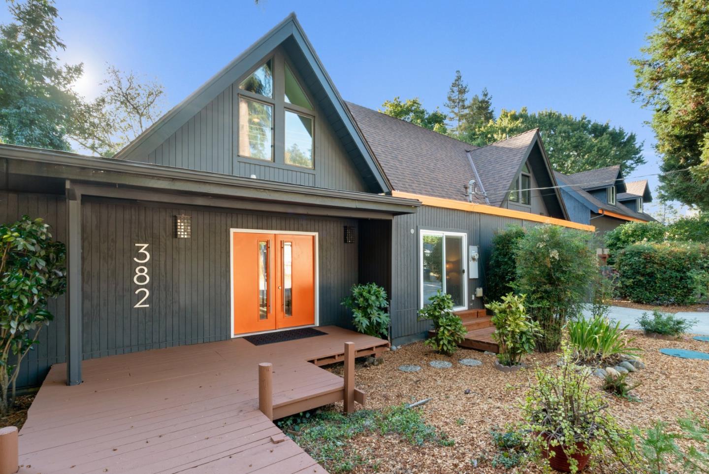 a front view of house with yard outdoor seating and green space
