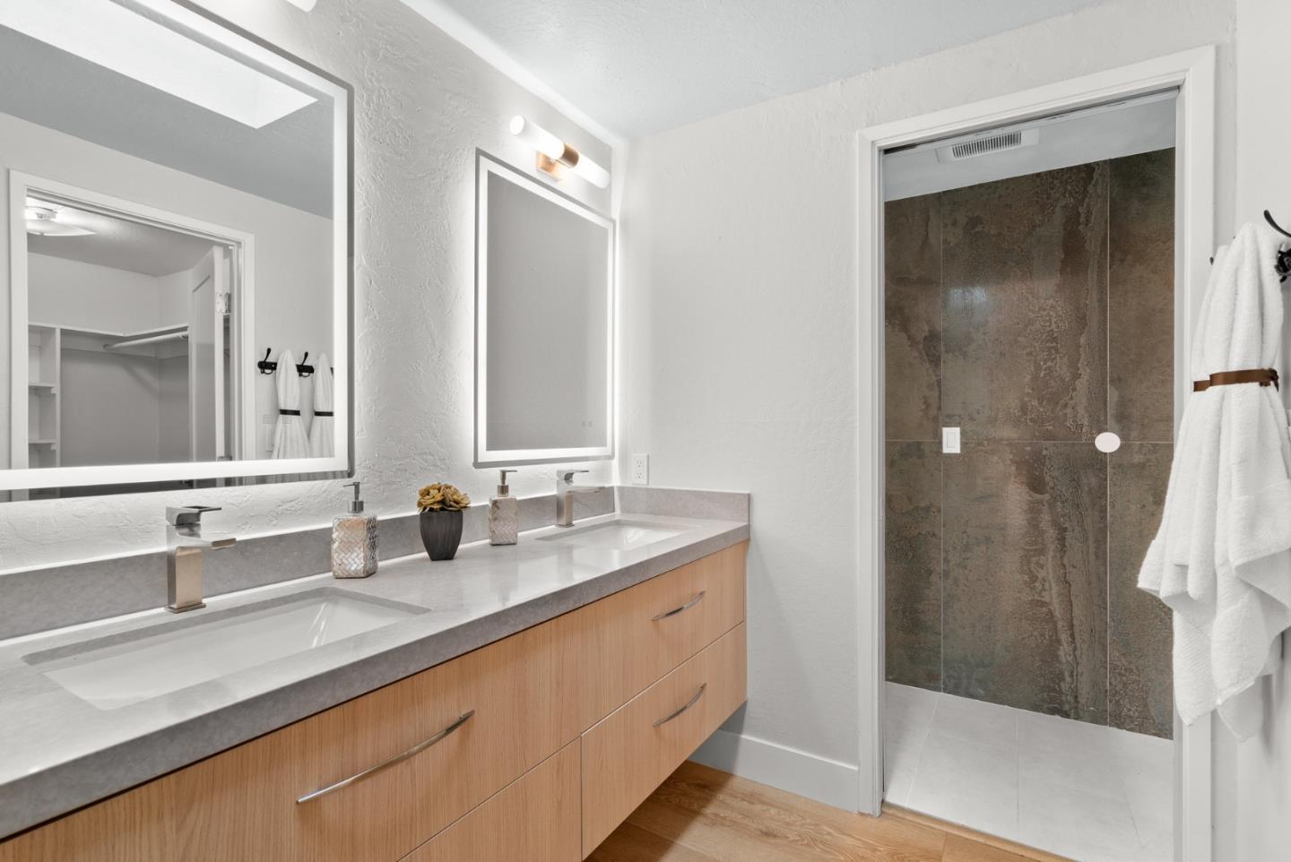 382 Riverside Avenue Ben Lomond, CA 95005 - Photo 31 of 85 a bathroom with a double vanity sink and a mirror