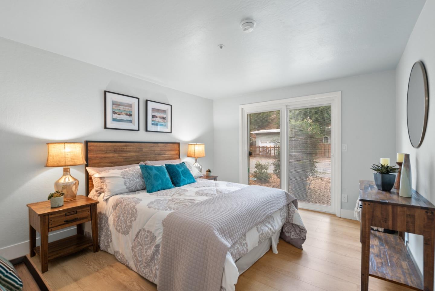 382 Riverside Avenue Ben Lomond, CA 95005 - Photo 35 of 85 a bedroom with a bed and wooden floor