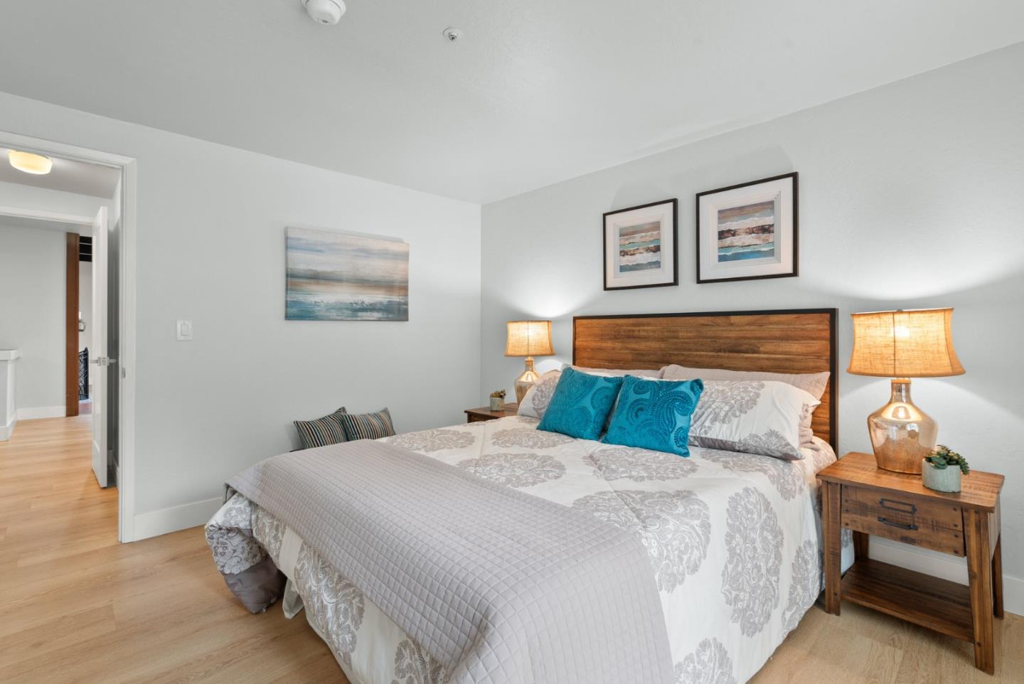 382 Riverside Avenue Ben Lomond, CA 95005 - Photo 36 of 85 a bedroom with a bed and wooden floor