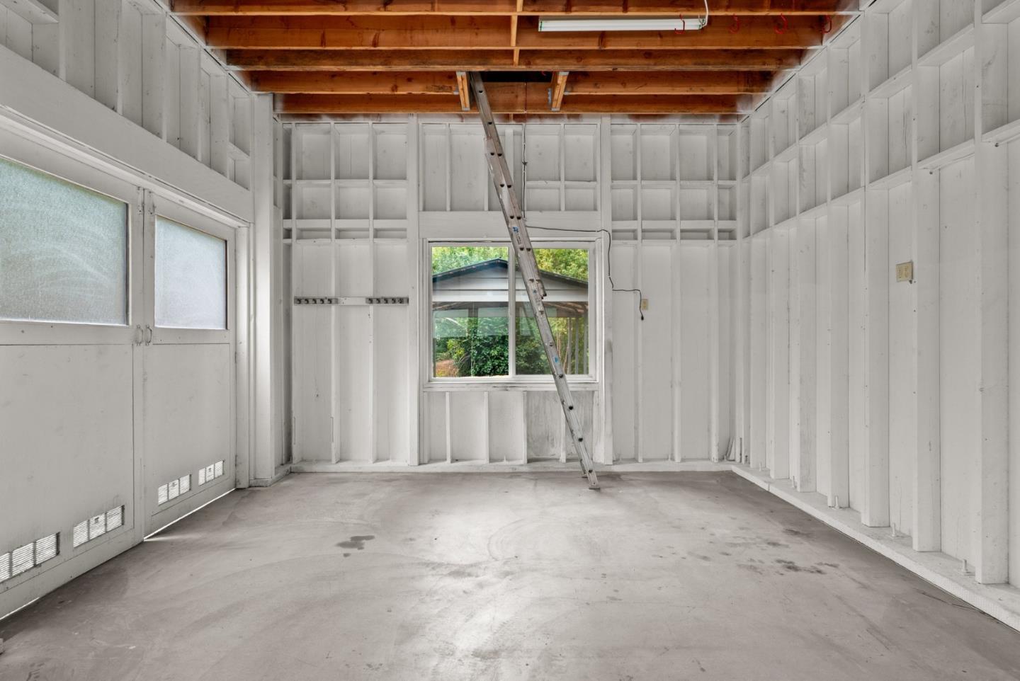 382 Riverside Avenue Ben Lomond, CA 95005 - Photo 59 of 85 a view of a room with racks on the wall