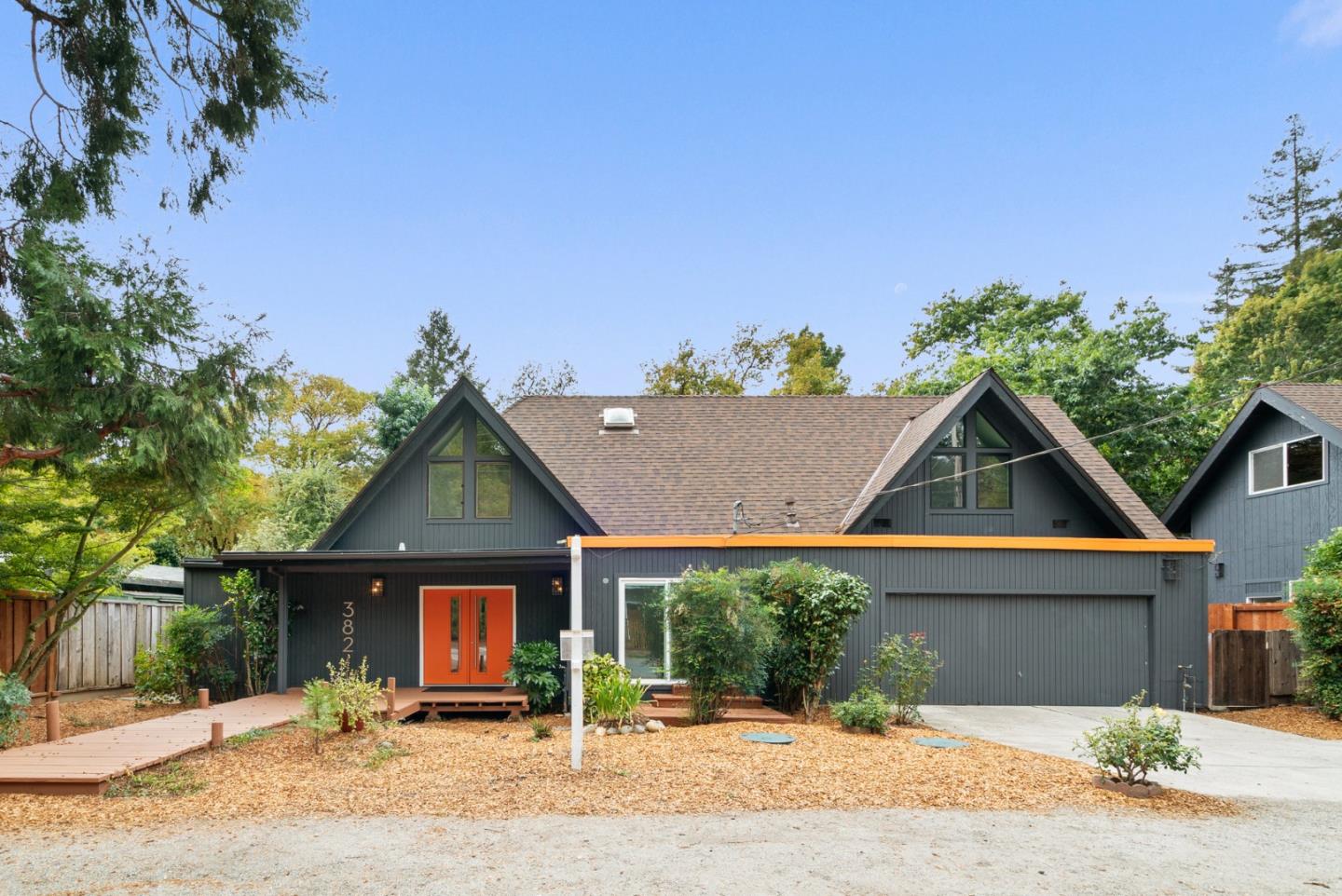 382 Riverside Avenue Ben Lomond, CA 95005 - Photo 62 of 85 a front view of a house with a yard and potted plants