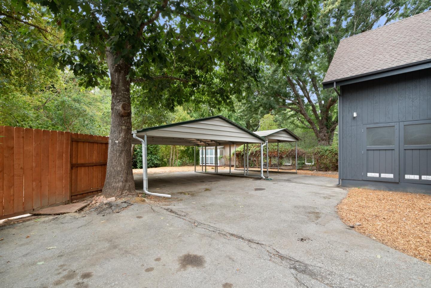 382 Riverside Avenue Ben Lomond, CA 95005 - Photo 85 of 85 a backyard of a house with barbeque oven table and chairs