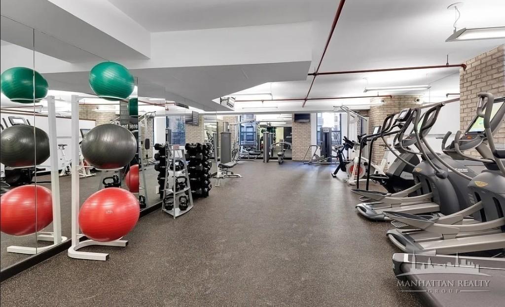 247 West 87th Street, Unit 3C Manhattan, NY 10024 - Photo 4 of 4 a room with gym equipment and windows
