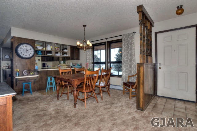 1363 21 Road Fruita, CO 81521 - Photo 4 of 9 a view of a dining room with furniture window and chandelier