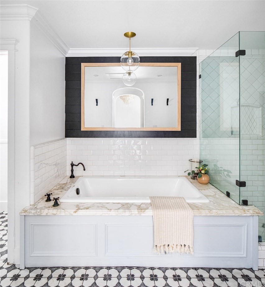 418 Broadway Costa Mesa, CA 92627 - Photo 13 of 27 a bathroom with a bathtub sink and mirror