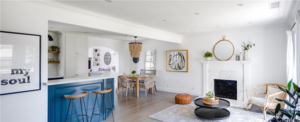 418 Broadway Costa Mesa, CA 92627 - Photo 2 of 27 a living room with furniture a fireplace and potted plant