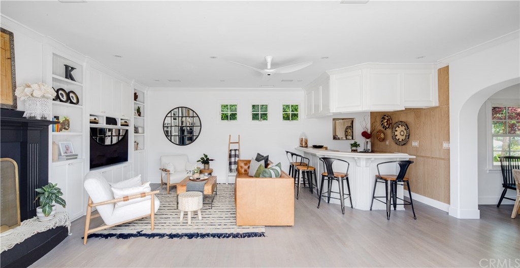 418 Broadway Costa Mesa, CA 92627 - Photo 21 of 27 a living room with fireplace furniture and a wooden floor