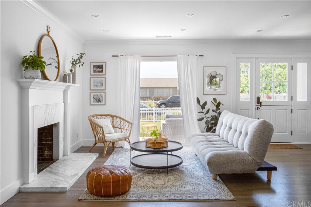 418 Broadway Costa Mesa, CA 92627 - Photo 3 of 27 a living room with furniture and a fireplace