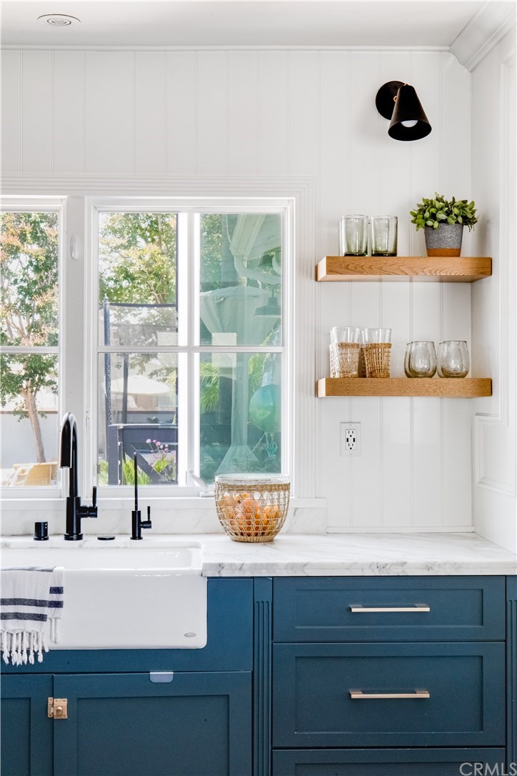 418 Broadway Costa Mesa, CA 92627 - Photo 6 of 27 a room with a window and cabinets