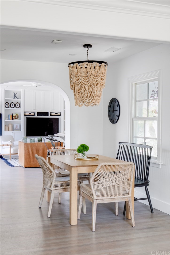 418 Broadway Costa Mesa, CA 92627 - Photo 8 of 27 a view of a dining room with furniture and wooden floor