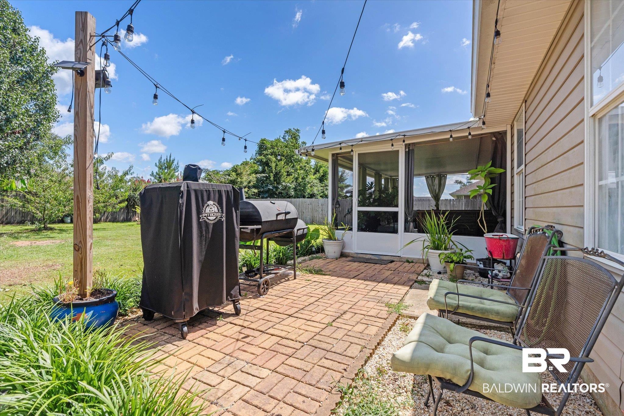 8600 Sable Court Semmes, AL 36575 - Photo 17 of 20 Fenced backyard featuring a sunroom, a patio area, and grilling area