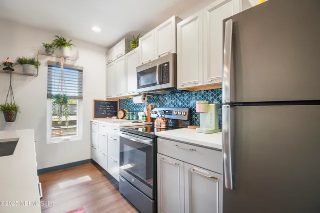 a bedroom with a bed and a mirror