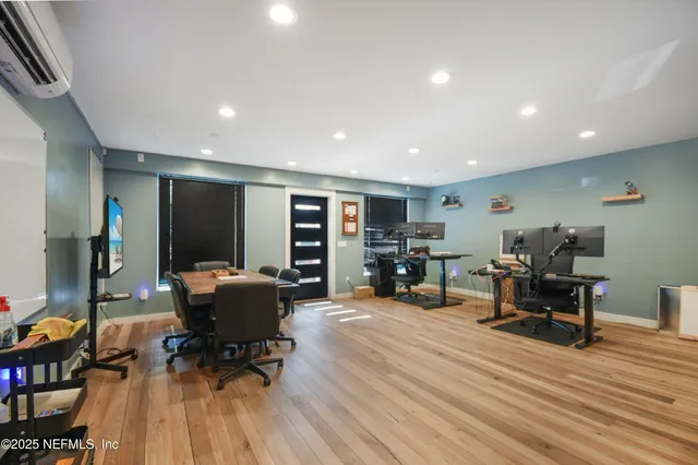 a couple of potted plants in front of door
