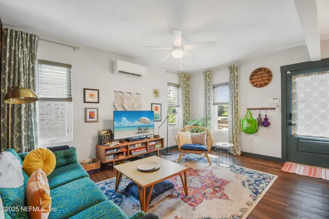 a kitchen that has a sink a stove and a table with chairs